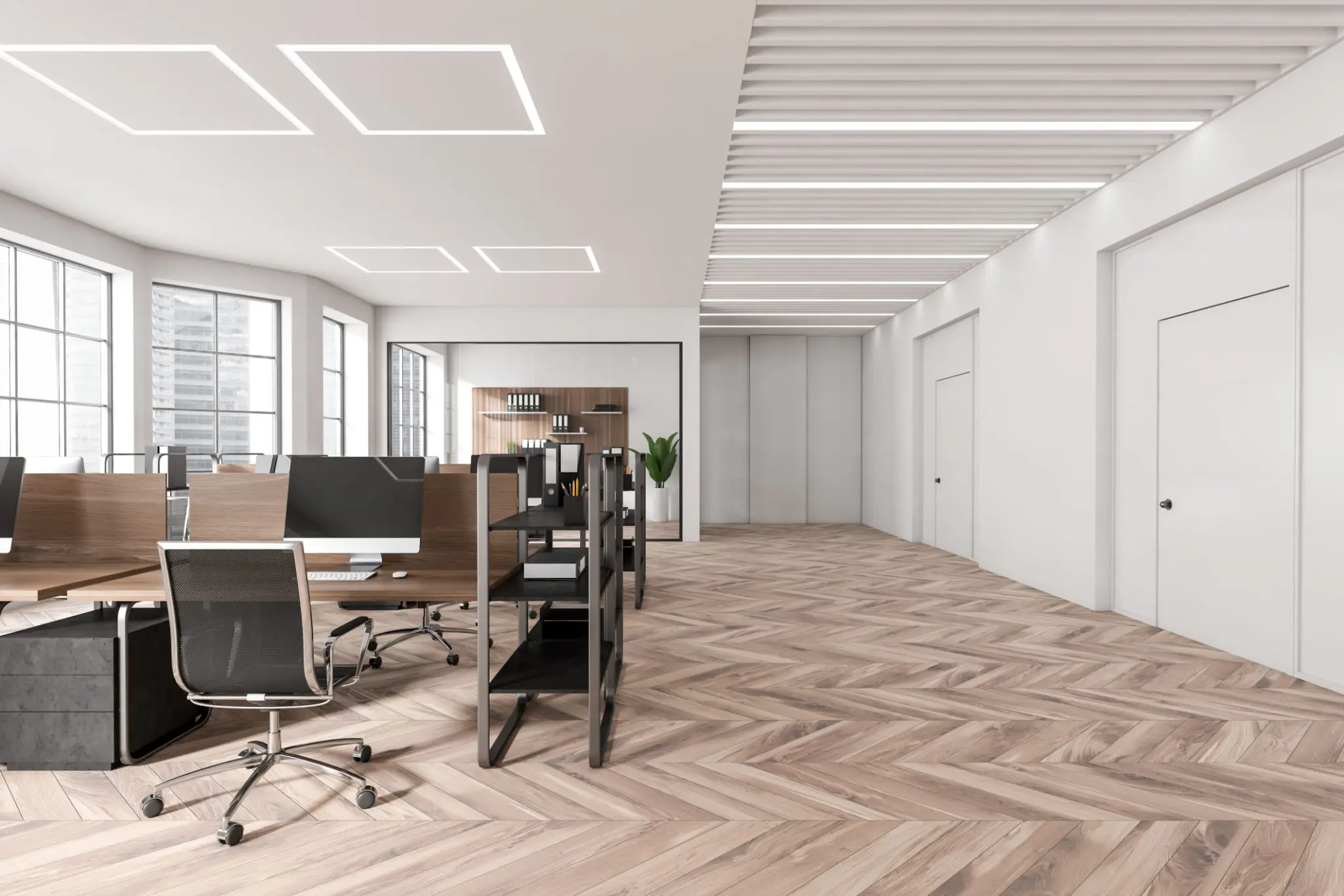 Modern open-plan office with minimalist design and ample natural light.