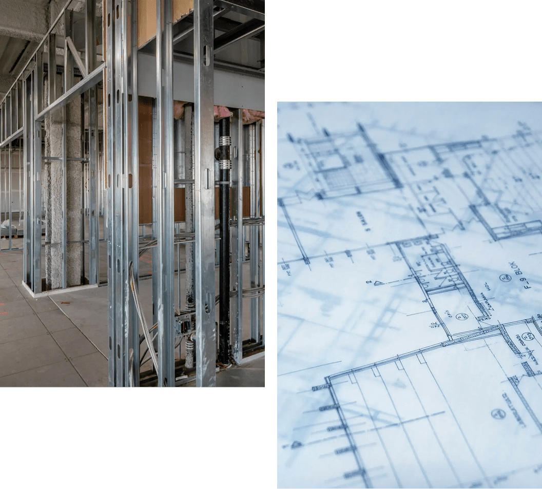 Steel framing in construction site with architectural blueprints.